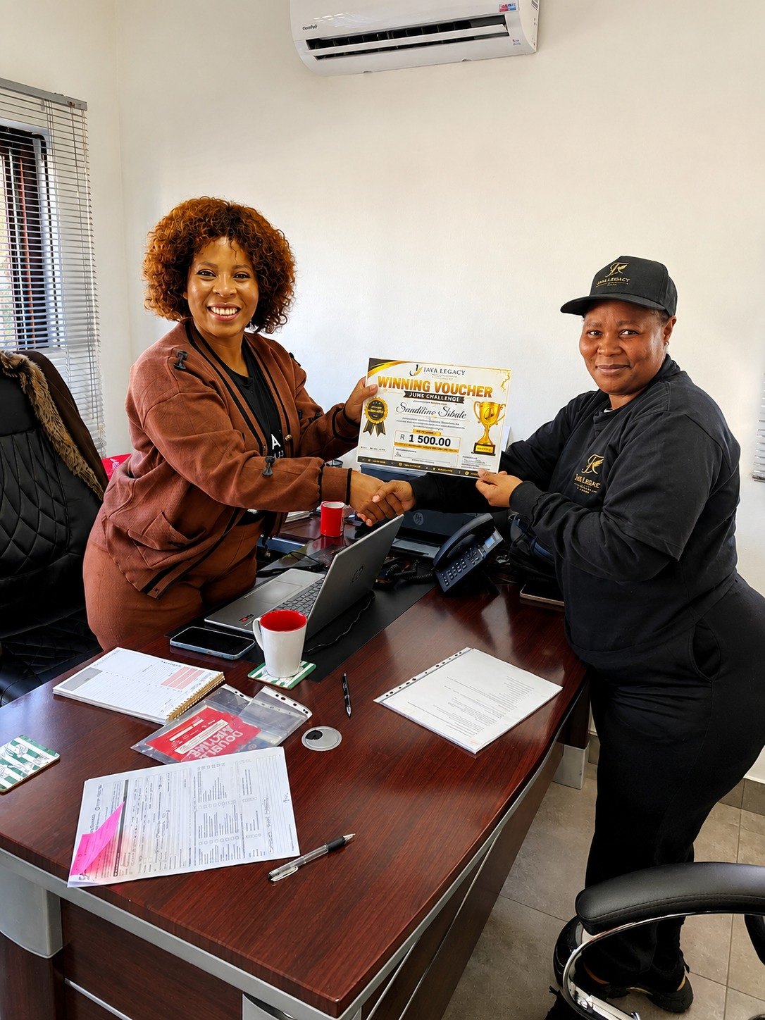 Java Legacy Funerals team celebrating an agent achievement